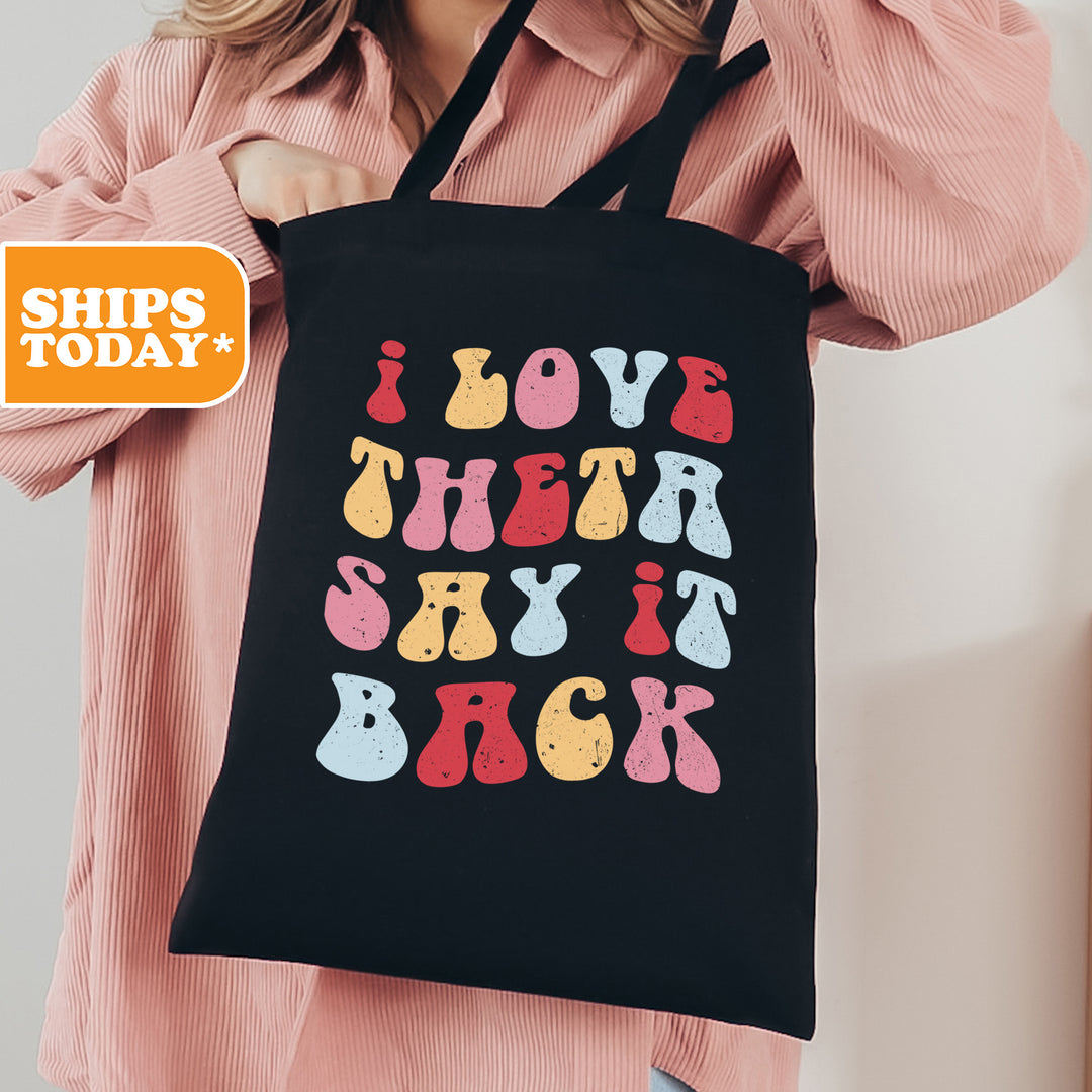 a woman holding a black shopping bag that says i love that sky is back