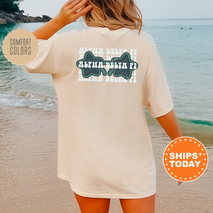 a woman standing on a beach next to the ocean