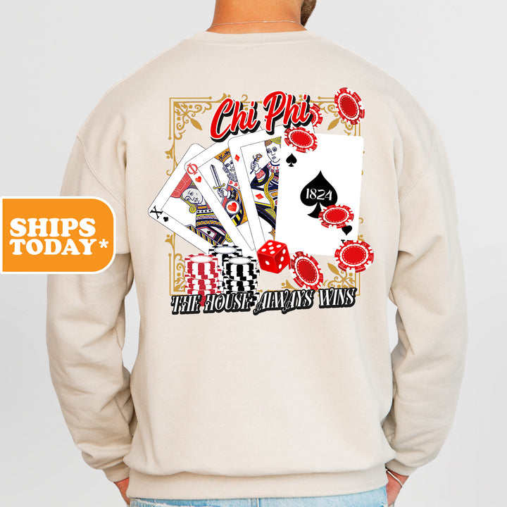 a man wearing a sweatshirt with a back print of playing cards