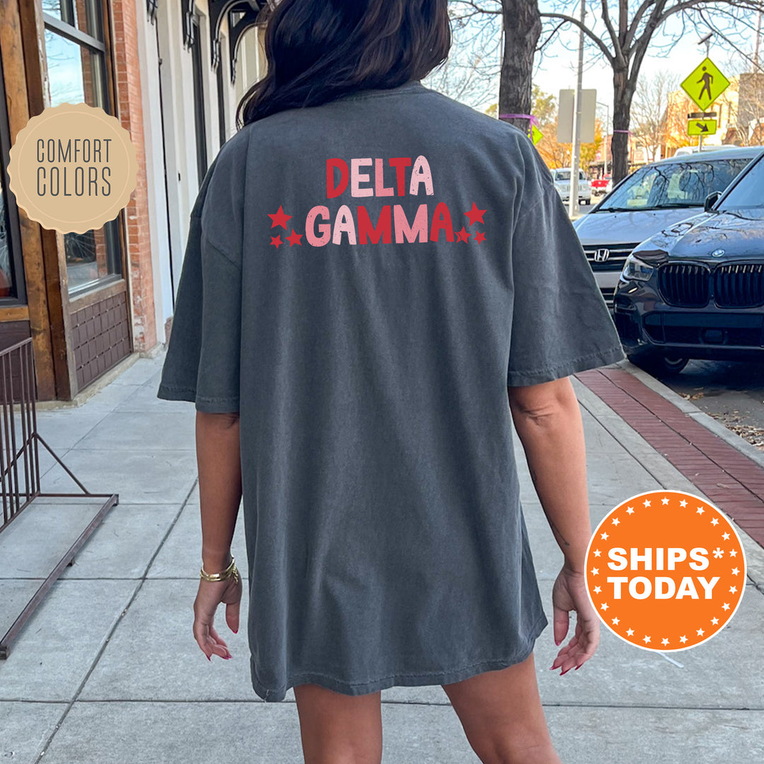 a woman walking down a sidewalk wearing a gray shirt