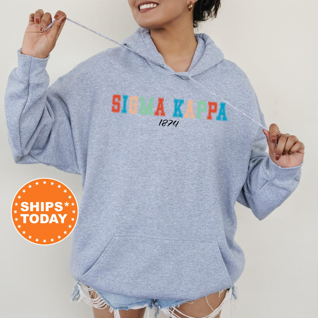 a woman wearing a blue hoodie with the word sukapa printed on it