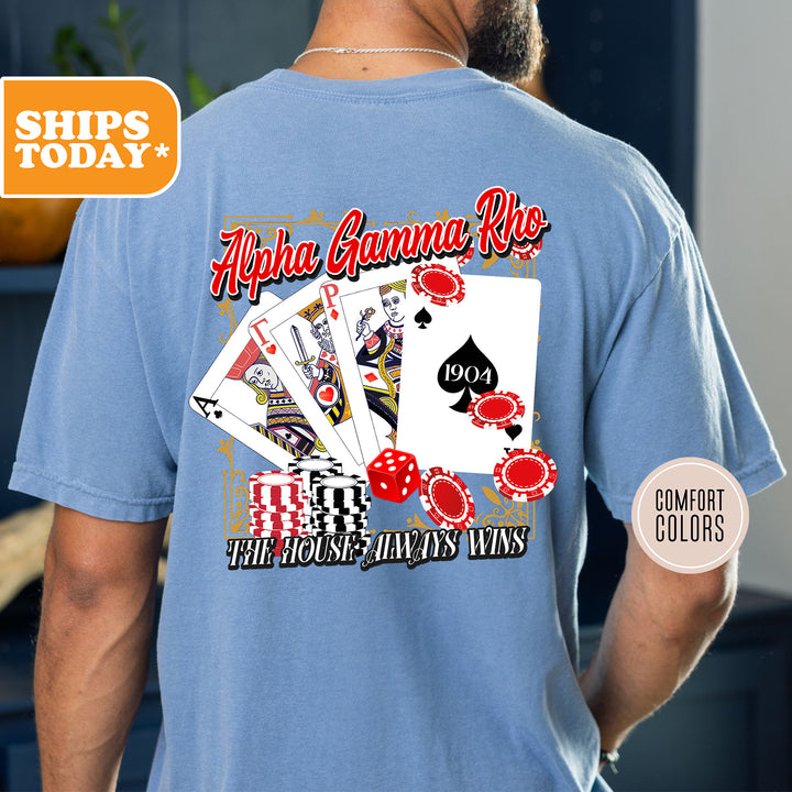 a man wearing a blue shirt with a picture of playing cards