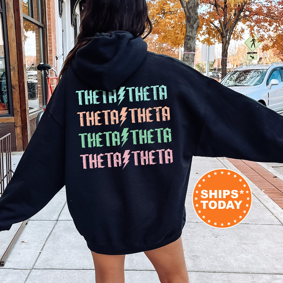 a woman wearing a black hoodie with the words theater on it