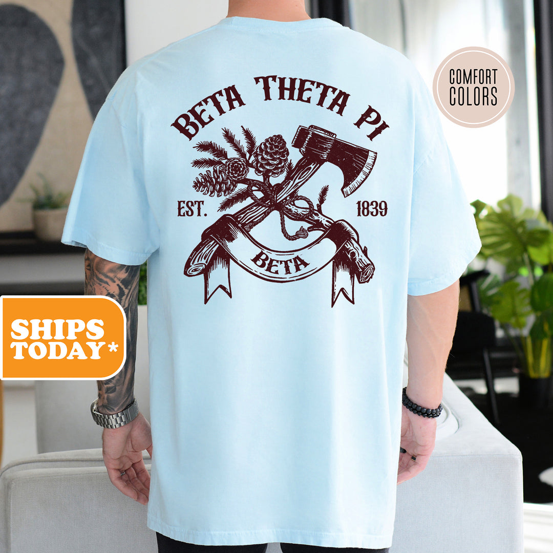 a man wearing a blue t - shirt with an image of a hammer and a