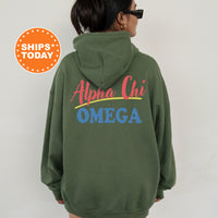 A person wearing a green hoodie with the text 