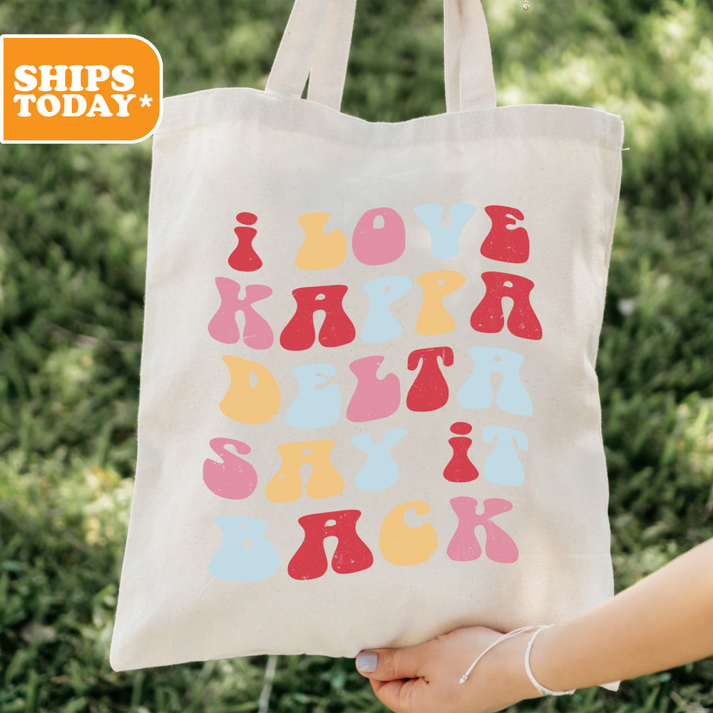 a person holding a tote bag in their hand