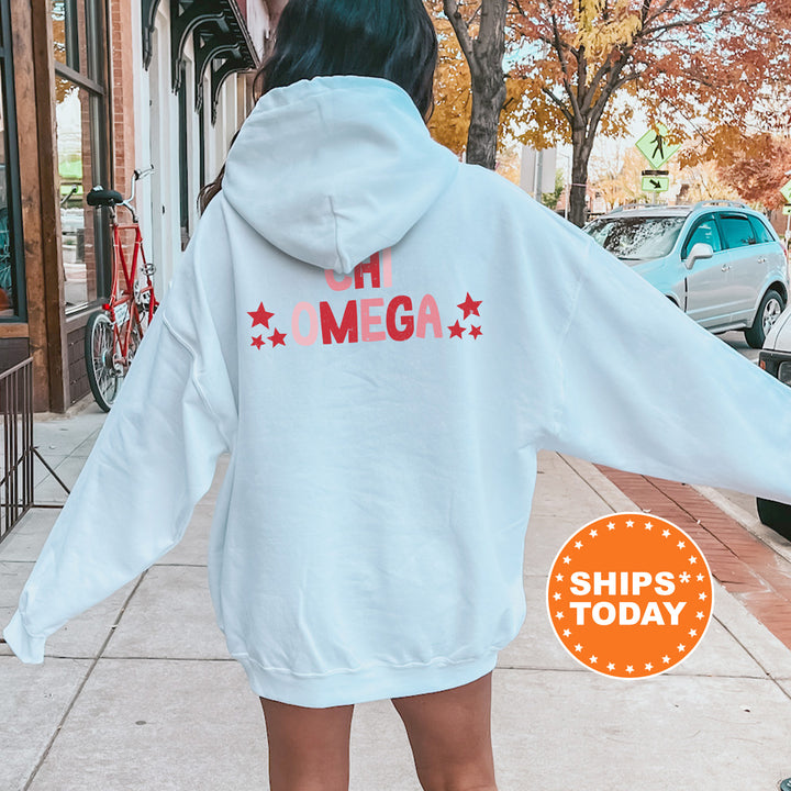 a woman in a white hoodie is walking down the street