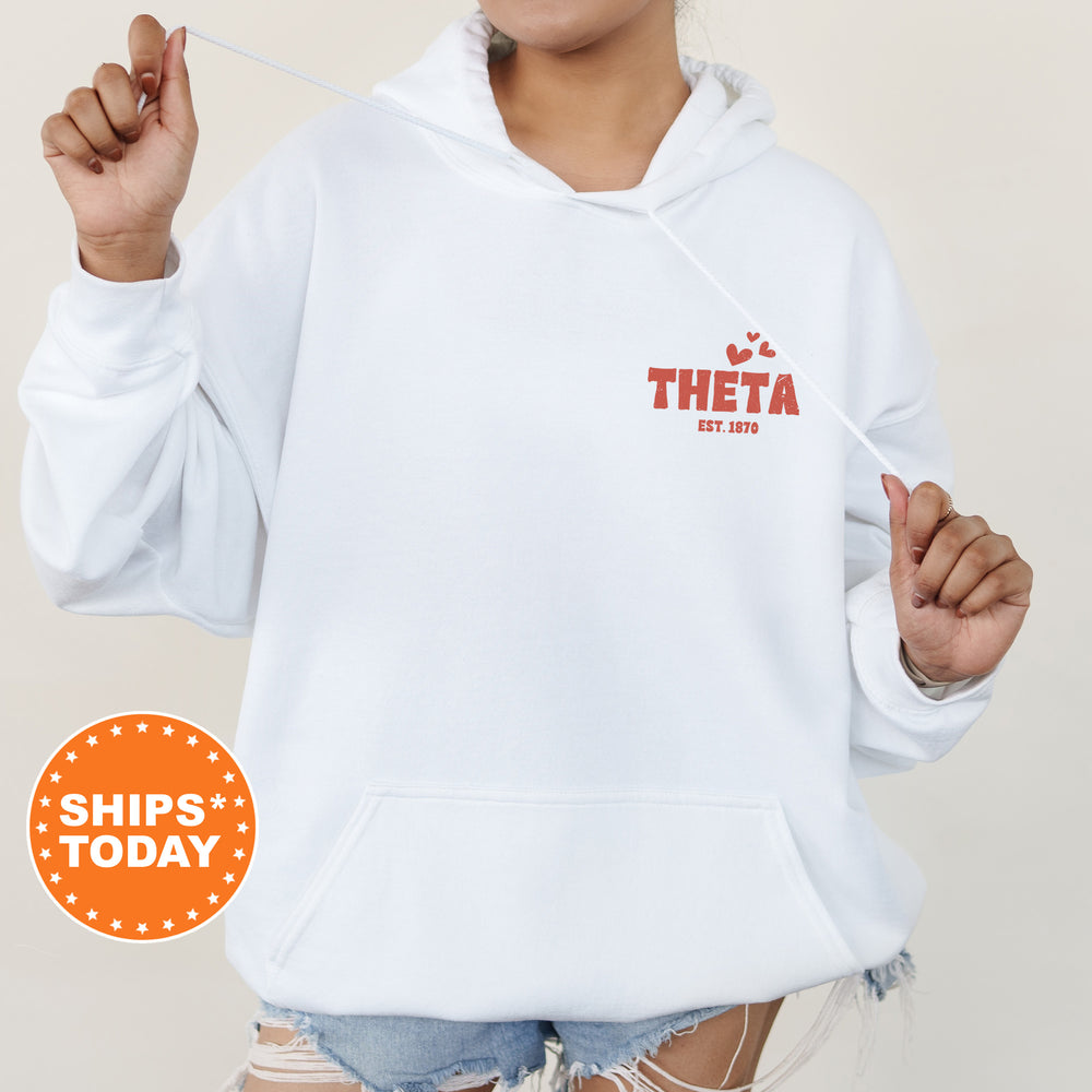 a woman wearing a white hoodie with the word thea printed on it