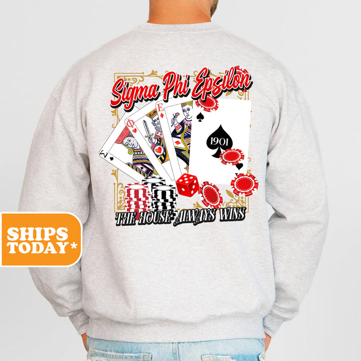 a man wearing a sweatshirt with a picture of playing cards on it
