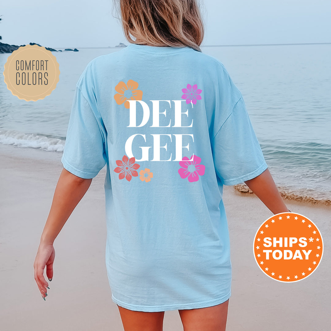 a woman walking on the beach wearing a t - shirt that says dee gee