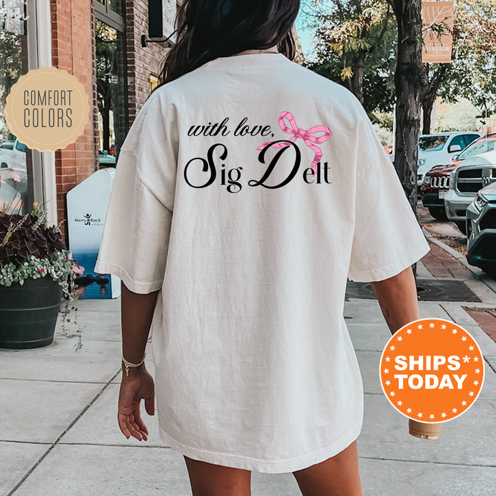 a woman walking down a sidewalk wearing a white shirt