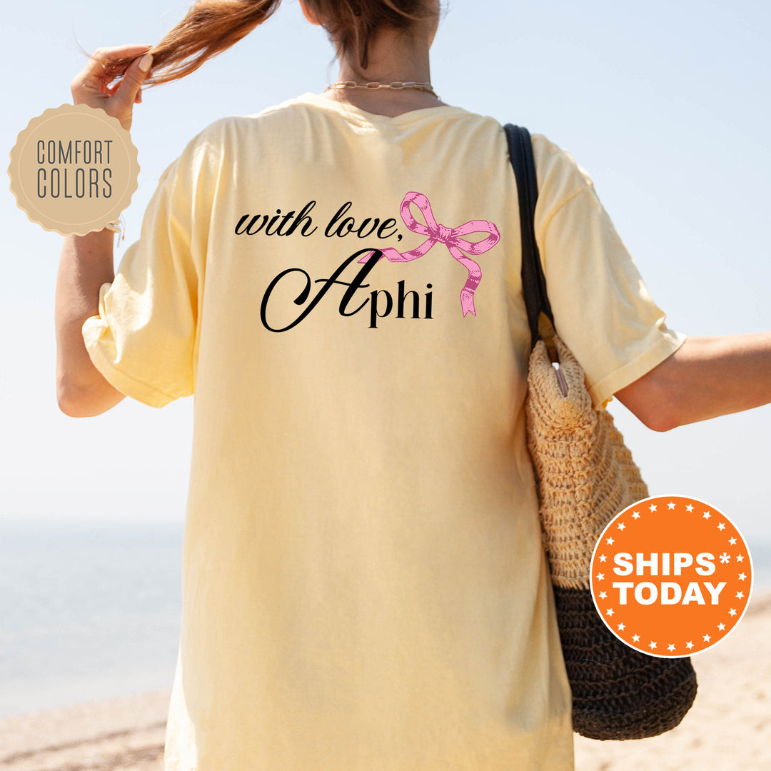 a woman walking on a beach holding a purse