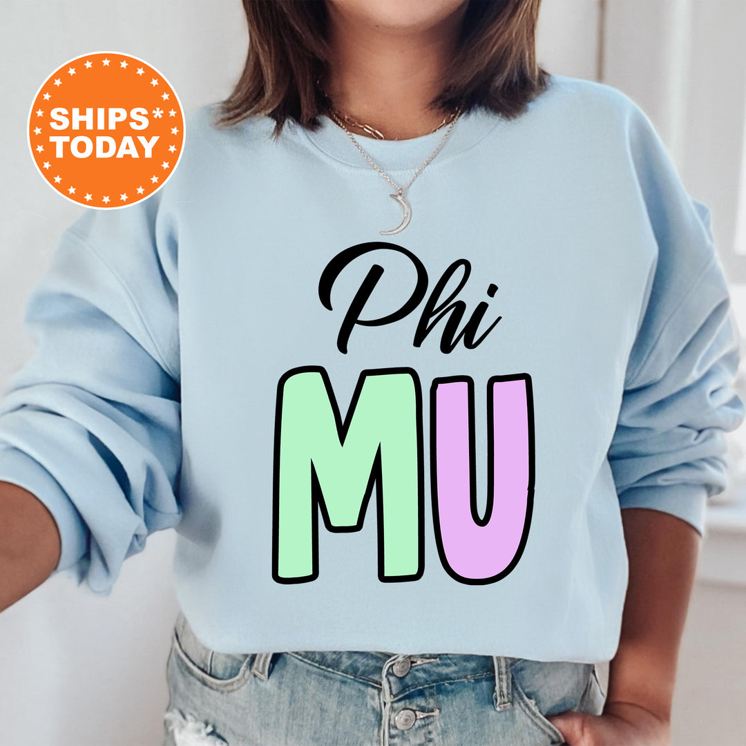 a woman wearing a sweatshirt that says phi mu