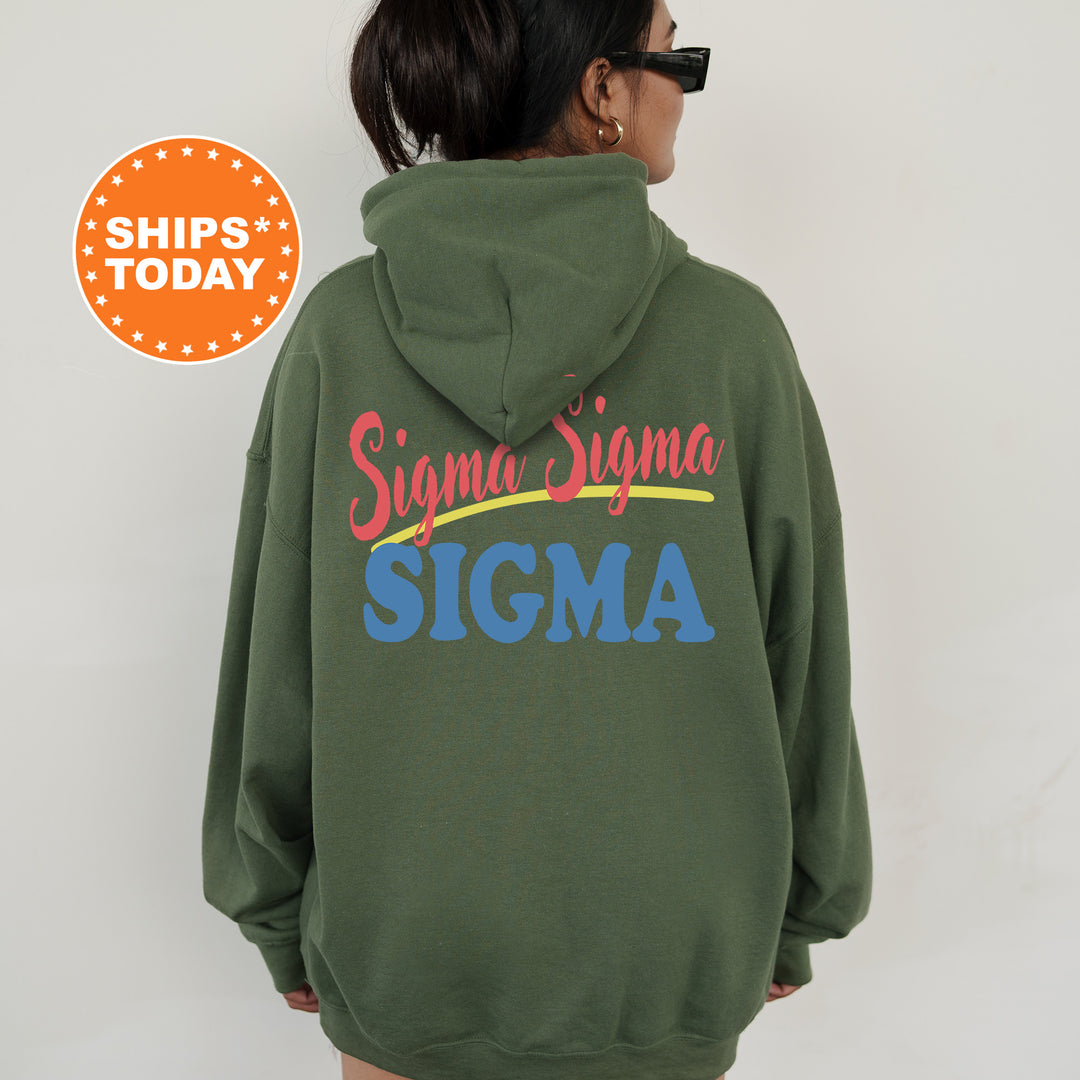 A person wearing a green hoodie with the text "Sigma Sigma" printed on it.