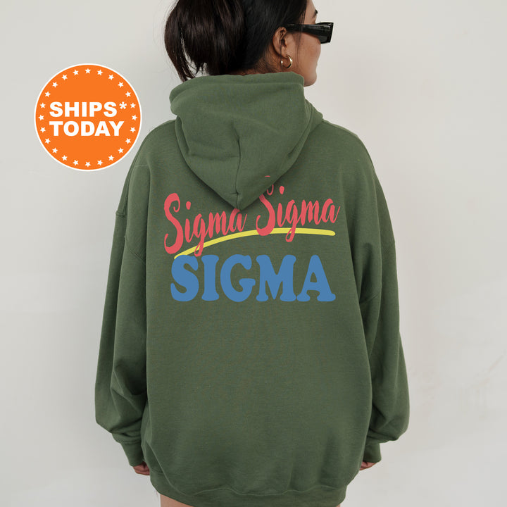 A person wearing a green hoodie with the text "Sigma Sigma" printed on it.