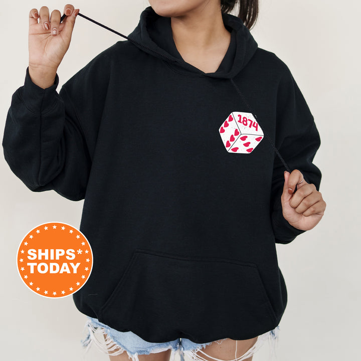 a woman wearing a black hoodie with a patch on it