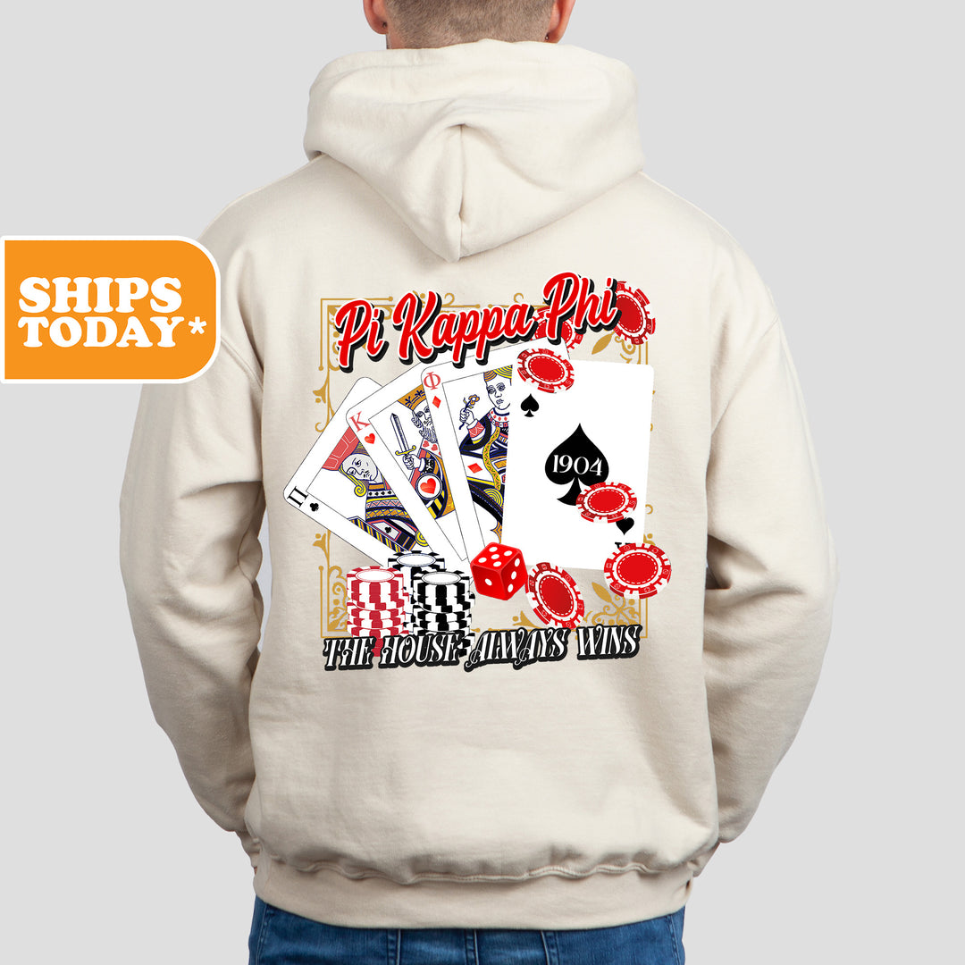 a man wearing a white hoodie with a picture of playing cards on it