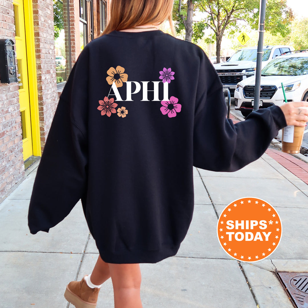 a woman walking down a sidewalk wearing a sweatshirt