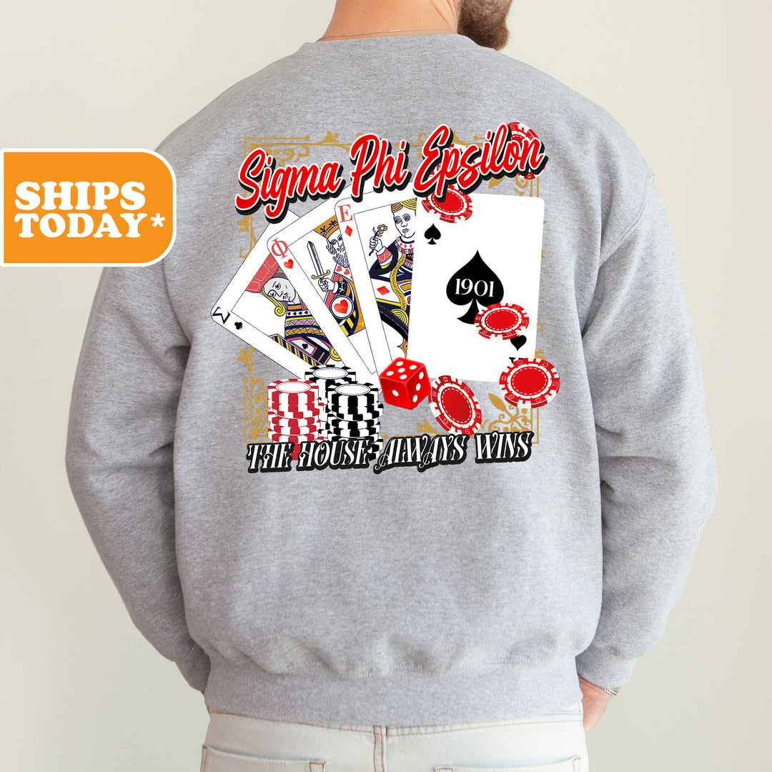 a man wearing a sweatshirt with a back print of playing cards