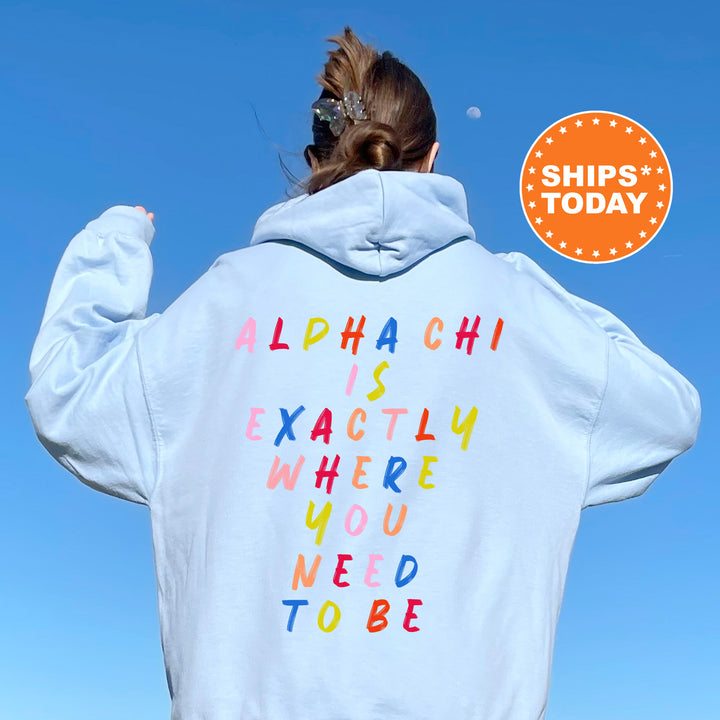 a woman wearing a white hoodie with colorful writing on it