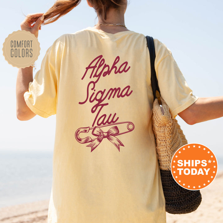 a woman walking on a beach holding a purse