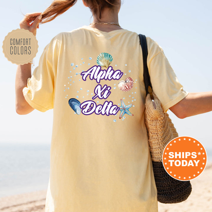 the back of a woman's yellow shirt that says aloh and dole