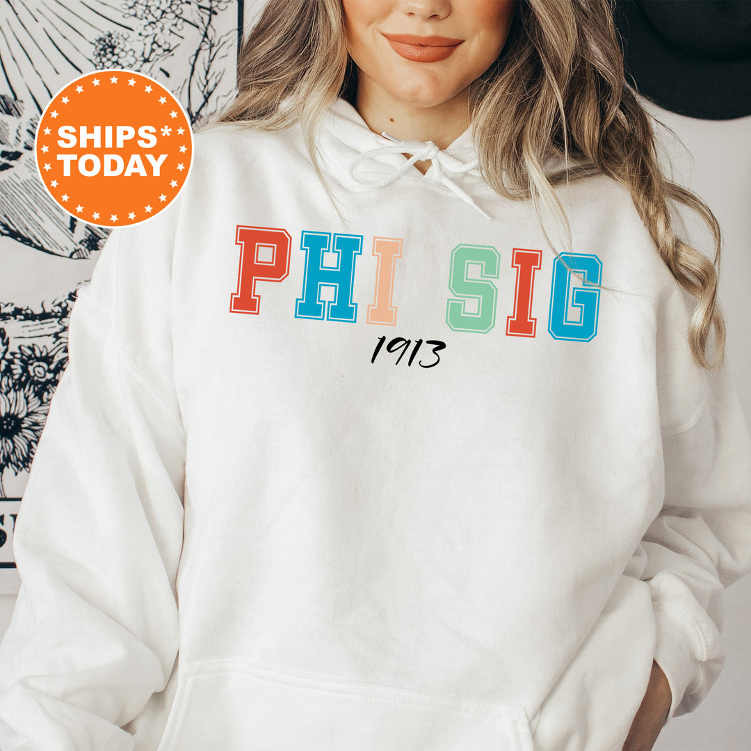 a woman wearing a white hoodie with the phrase phi sig printed on it