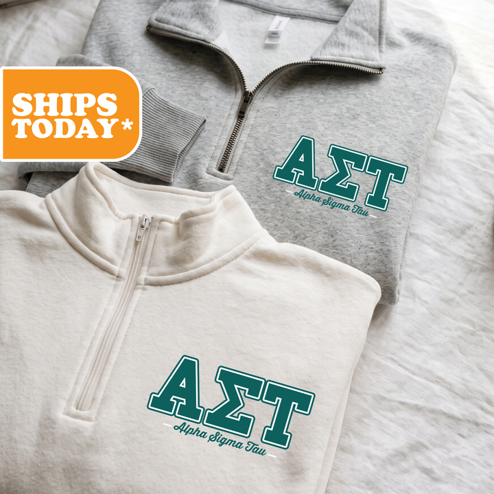 Two gray sweatshirts with the Greek letters "ΚΥΛΙ" printed on them, along with the text "ΚΥΛΙ Alpha Sigma Delta Tau" printed below.