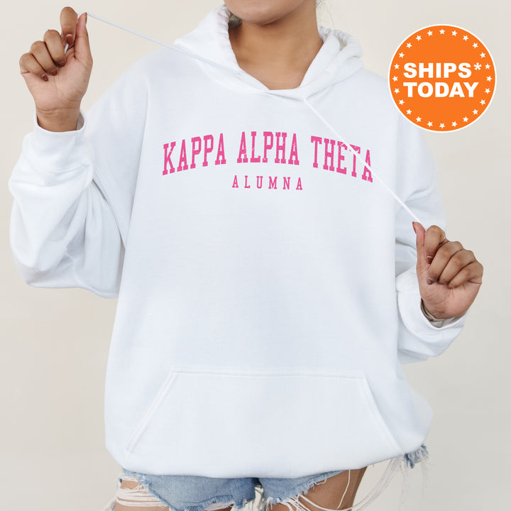 a woman wearing a white hoodie with pink letters on it