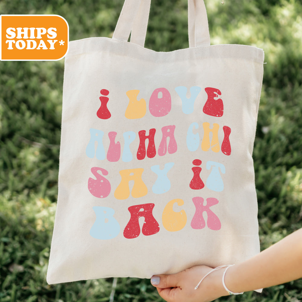 a person holding a tote bag with a message on it