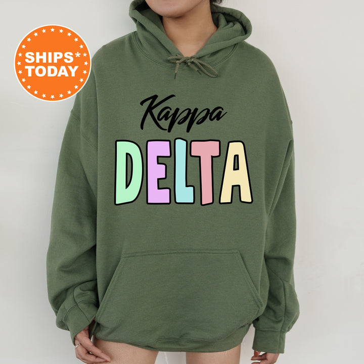 a woman wearing a green hoodie with the words kapaa delta on it