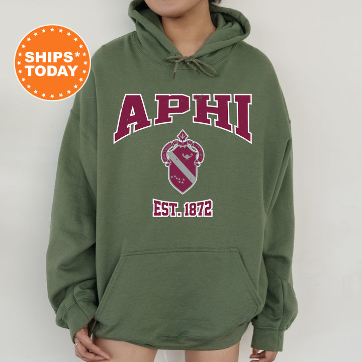 a person wearing a green hoodie with the words aphi on it