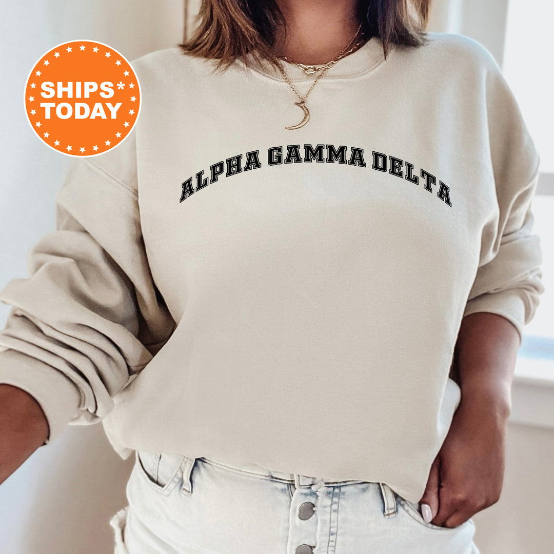 a woman wearing a sweatshirt with the words alpa gama delta on it