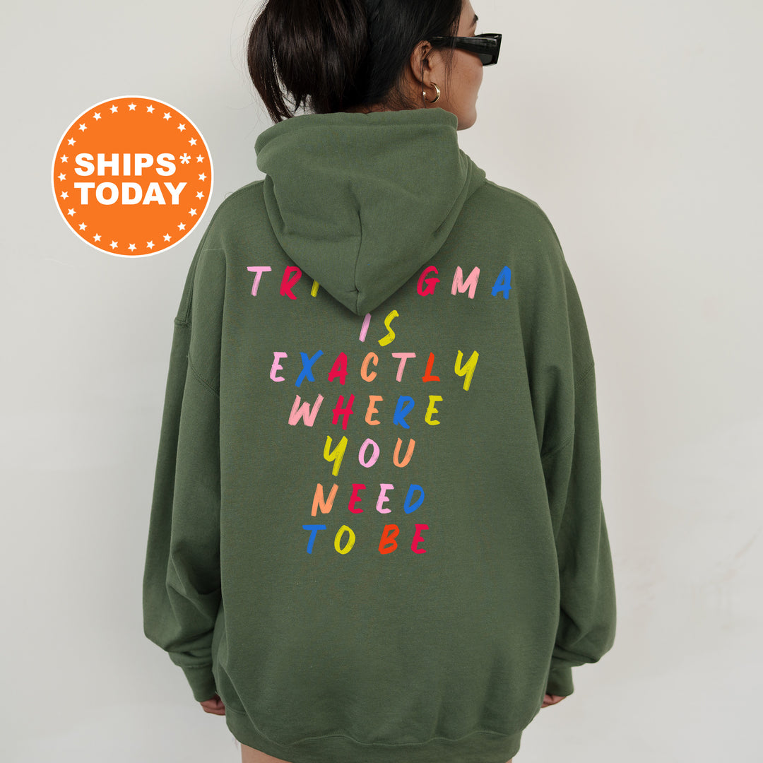 a woman wearing a green sweatshirt with the words trip's today written on it