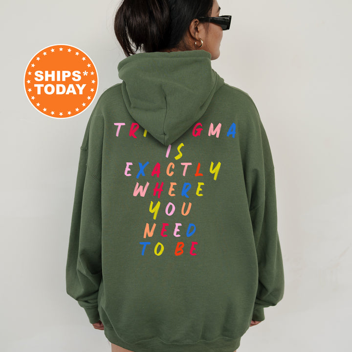 a woman wearing a green sweatshirt with the words trip's today written on it