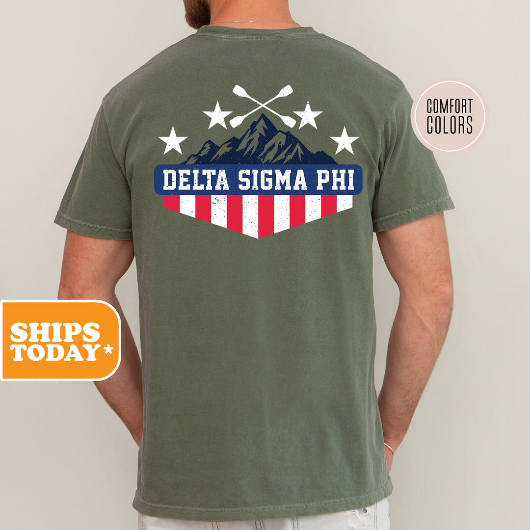 a man wearing a green shirt with a flag and mountains on it