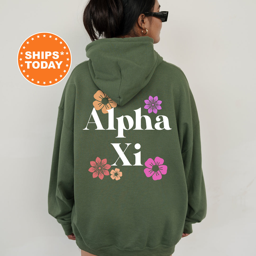 a woman wearing a green hoodie with flowers on it