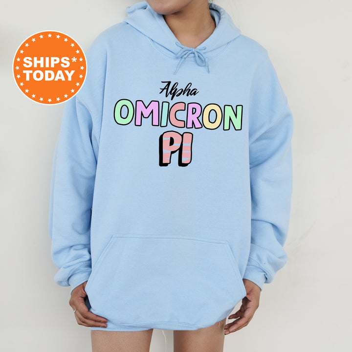 a woman wearing a light blue hoodie with the words ahha omicron