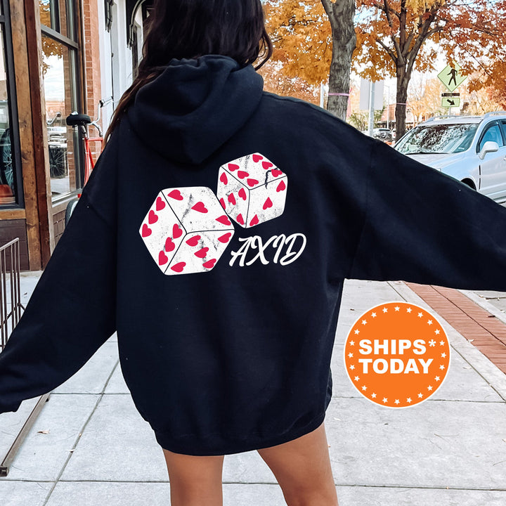 a woman in a black hoodie is walking down the street