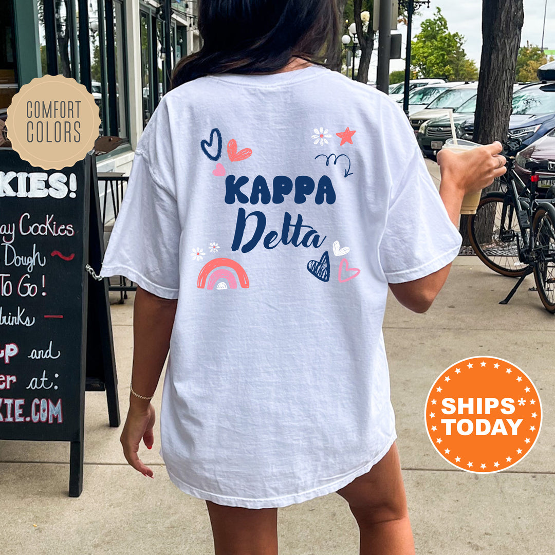 a woman walking down a sidewalk while wearing a t - shirt