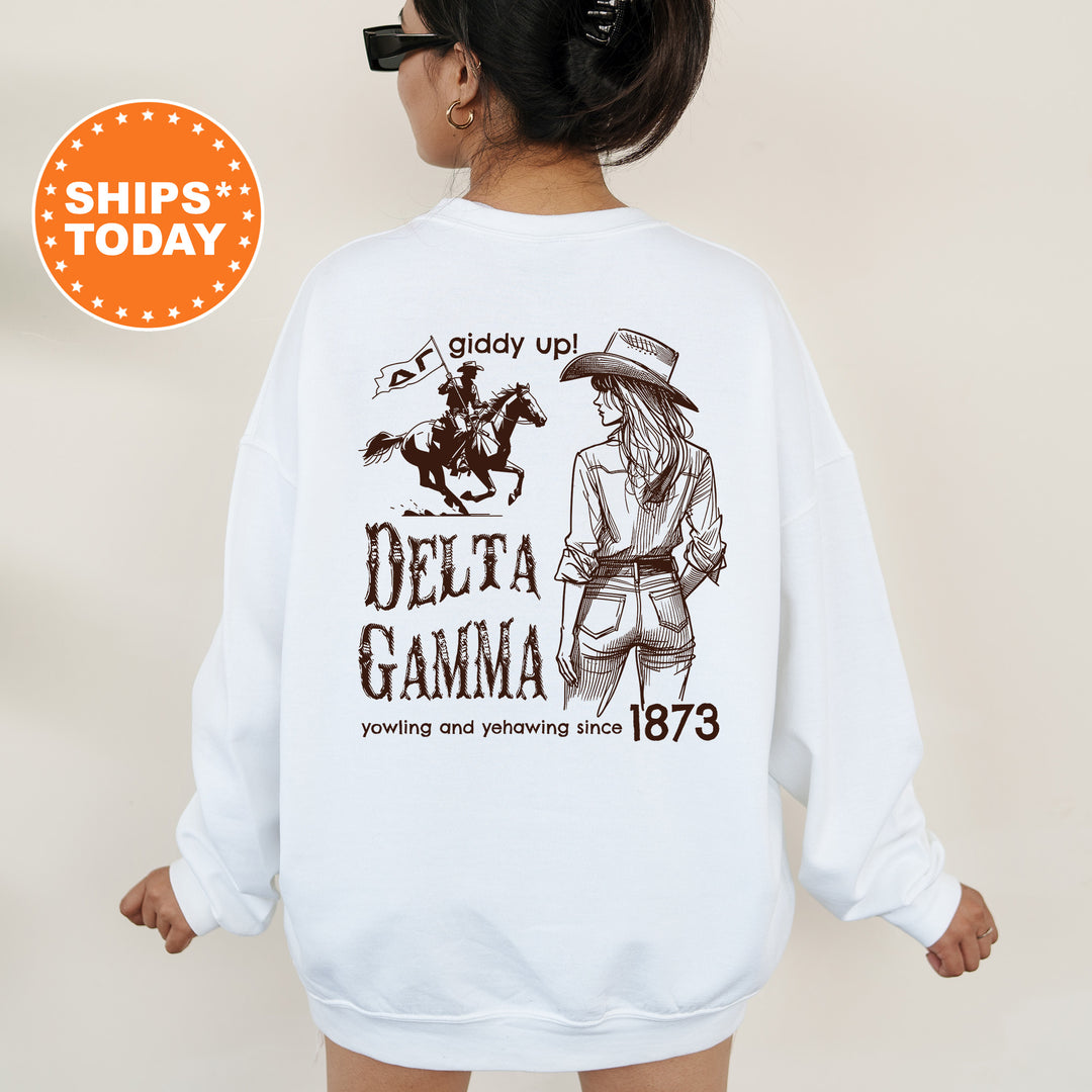 a woman wearing a white sweatshirt with a drawing of a cowboy riding a horse