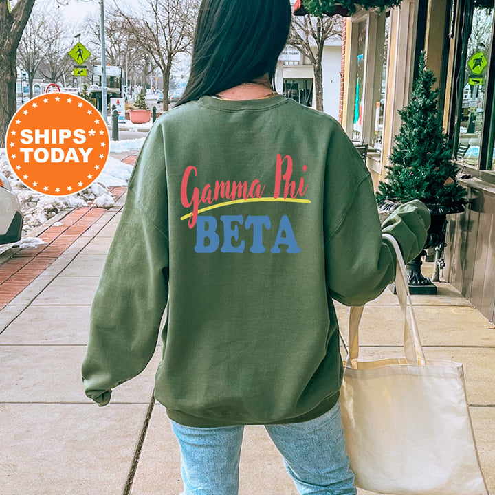 A person wearing a green sweatshirt with the text "Gamma Phi Beta" printed on it, walking on a sidewalk.