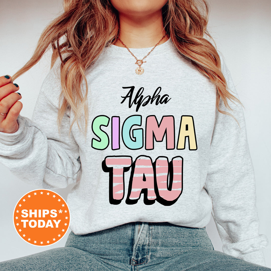 a woman wearing a sweater that says, aloha stigma tau