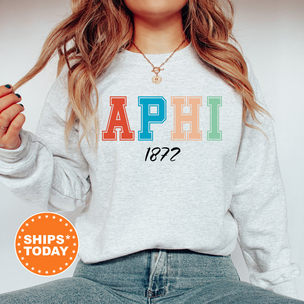 a woman wearing a sweatshirt with the word aphi on it