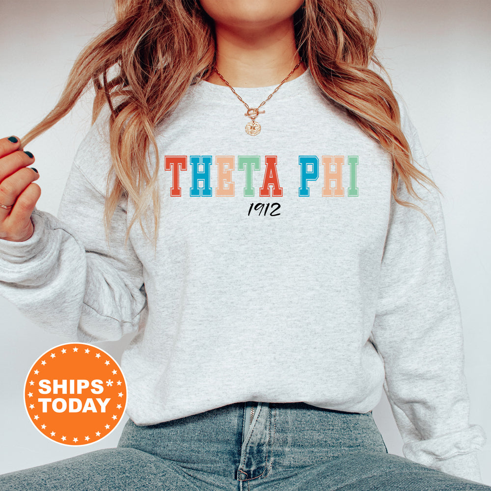 a woman wearing a sweatshirt with the words theatre on it