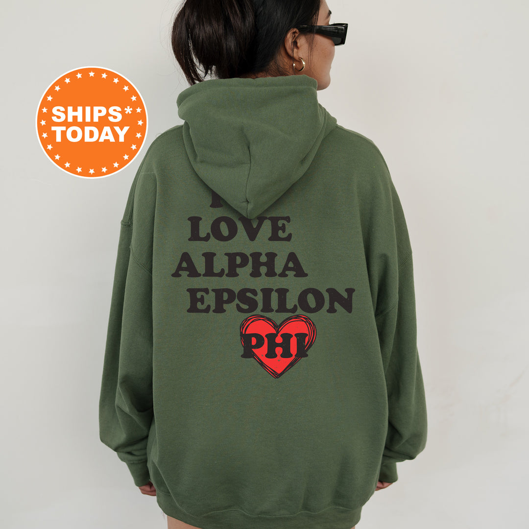 a woman wearing a green hoodie with a heart on it