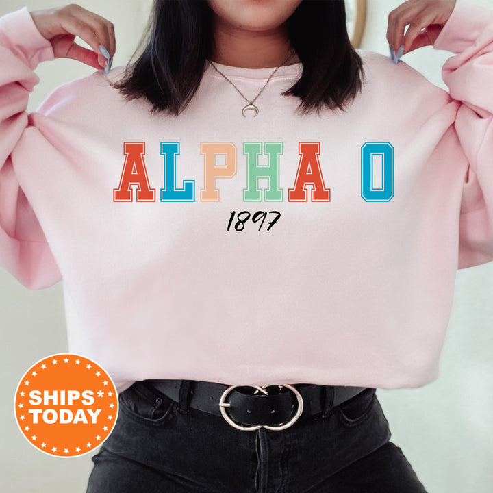 a woman wearing a pink sweatshirt with the word alphao printed on it