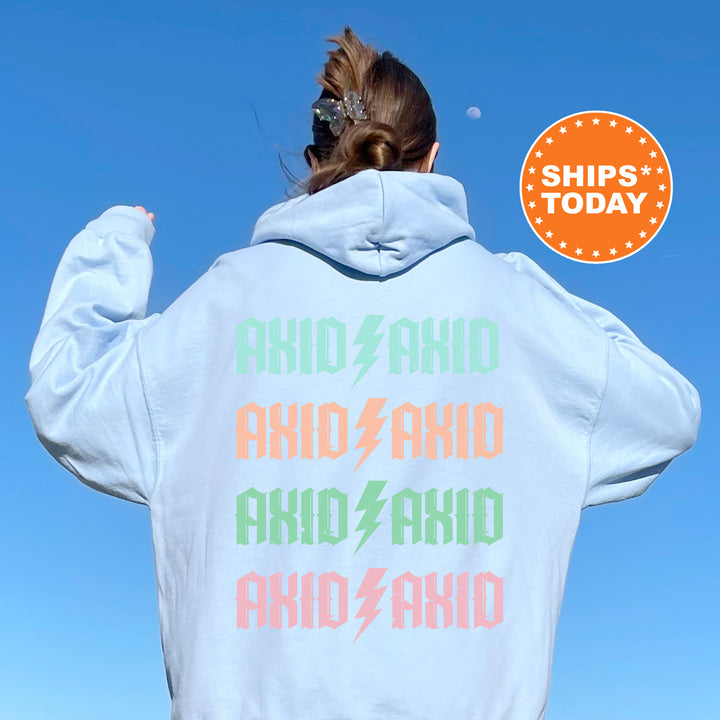 a woman with her back to the camera wearing a white hoodie