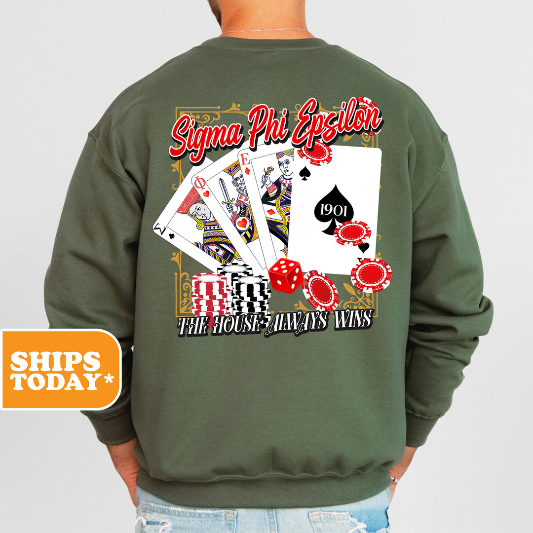 a man wearing a green sweatshirt with playing cards on it