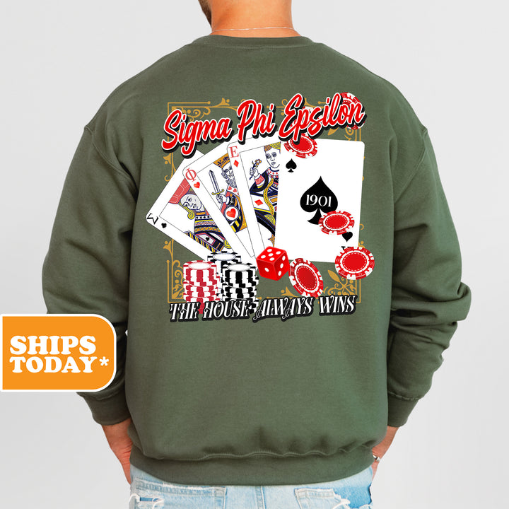a man wearing a green sweatshirt with playing cards on it
